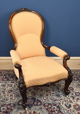 Lot 2831 - A Victorian spoon back armchair upholstered in...
