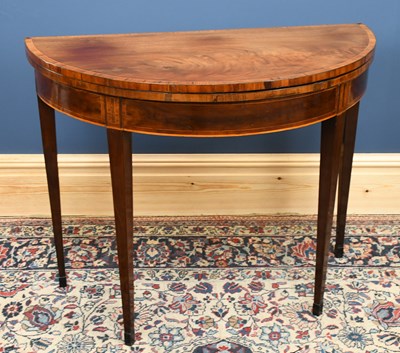 Lot 2771 - A Georgian mahogany demi-lune fold over games...