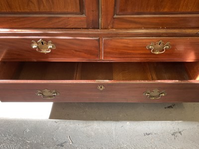 Lot 29 - An early 19th century mahogany linen press,...