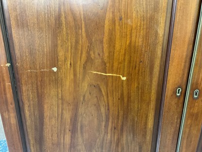 Lot 29 - An early 19th century mahogany linen press,...