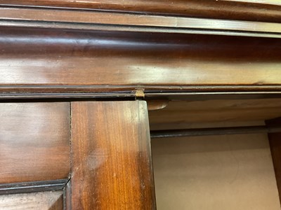 Lot 29 - An early 19th century mahogany linen press,...