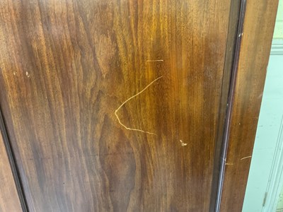 Lot 29 - An early 19th century mahogany linen press,...