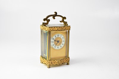 Lot 133 - A brass cased carriage clock with Rococo...