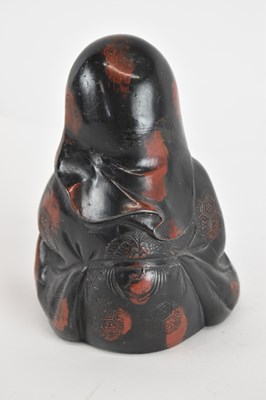 Lot 668 - A small metal figure of Shou Lao, with traces...