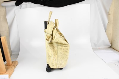 Lot 596 - GIVENCHY; a cream and beige crocodile embossed...