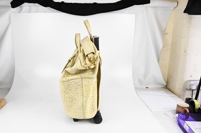 Lot 596 - GIVENCHY; a cream and beige crocodile embossed...