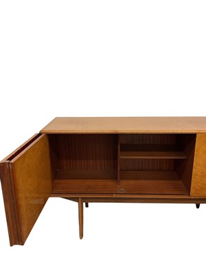 Lot 31 - A mid century satinwood veneered sideboard and...