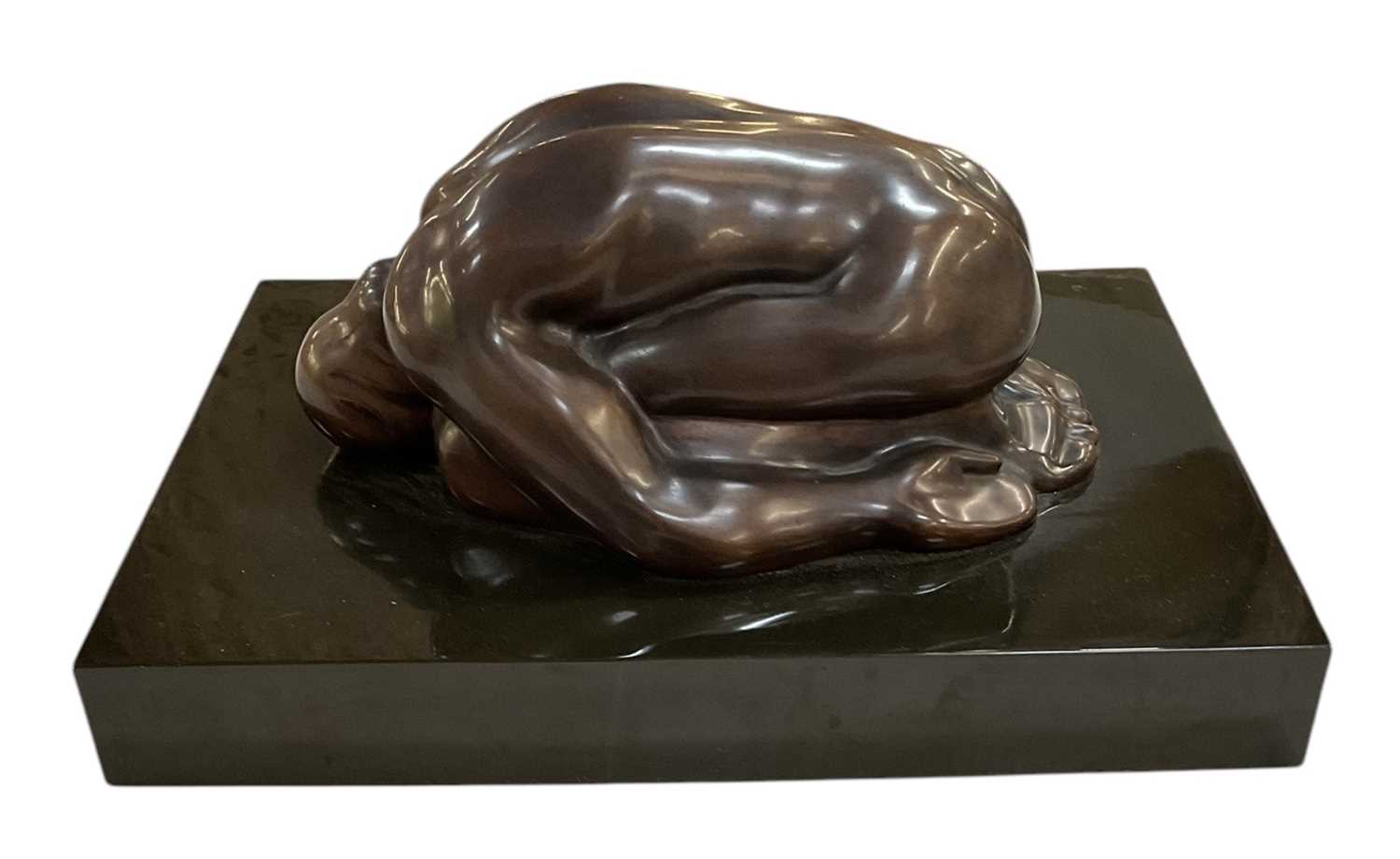 Lot 744 - A modern abstract bronze figure of kneeling...