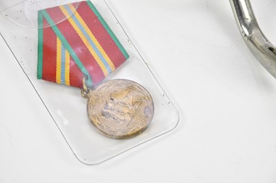 Lot 2463 - A collection of assorted militaria including...