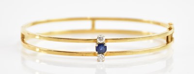 Lot 217 - An 18ct yellow gold sapphire and diamond...