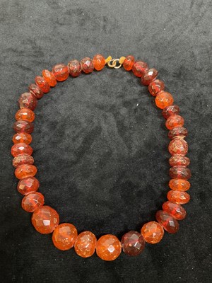 Lot 334 - Two graduated Baltic amber bead necklaces,...