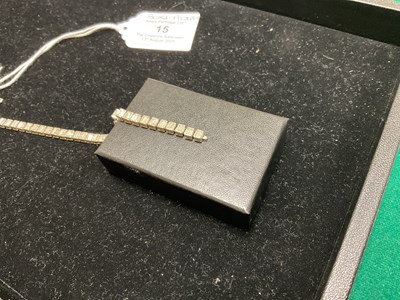Lot 15 - A white metal diamond set tennis bracelet,...