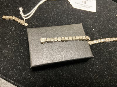 Lot 15 - A white metal diamond set tennis bracelet,...