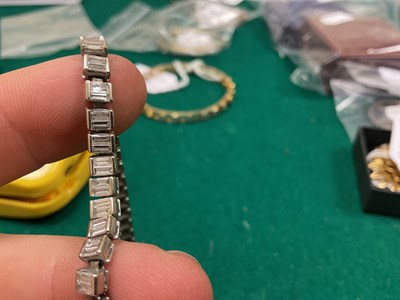 Lot 15 - A white metal diamond set tennis bracelet,...