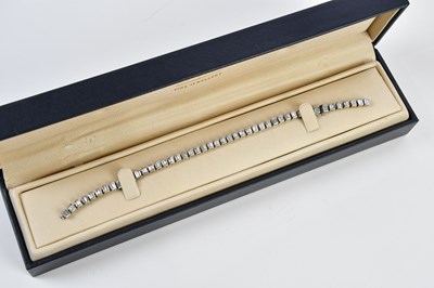 Lot 15 - A white metal diamond set tennis bracelet,...