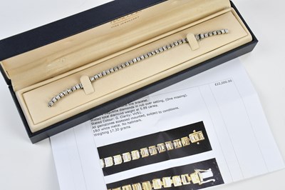 Lot 15 - A white metal diamond set tennis bracelet,...