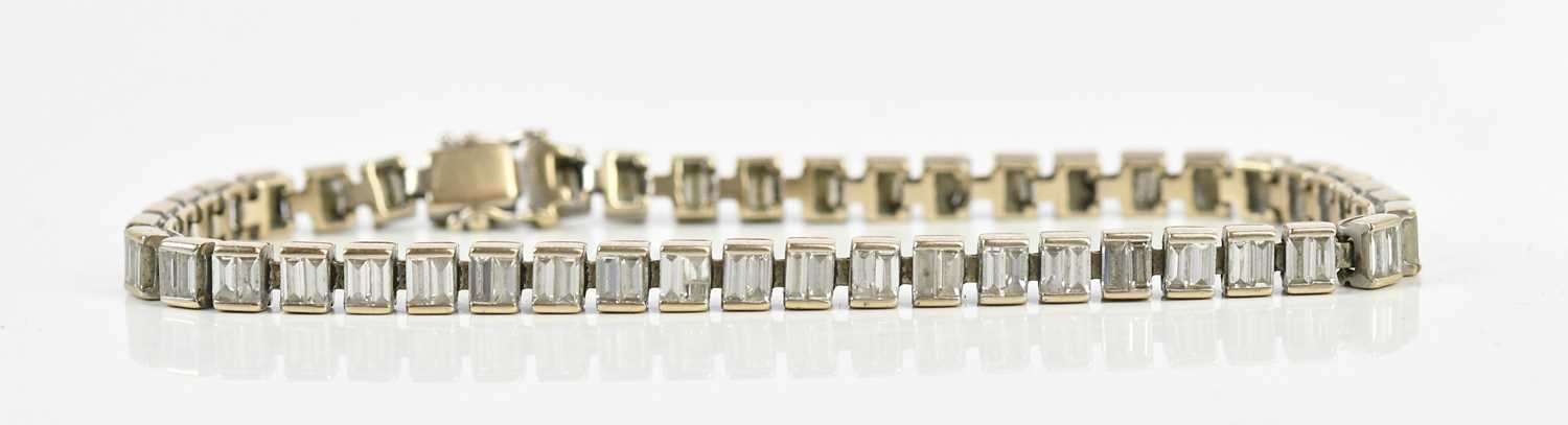 Lot 15 - A white metal diamond set tennis bracelet,...