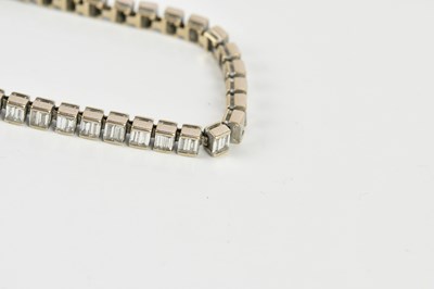Lot 15 - A white metal diamond set tennis bracelet,...