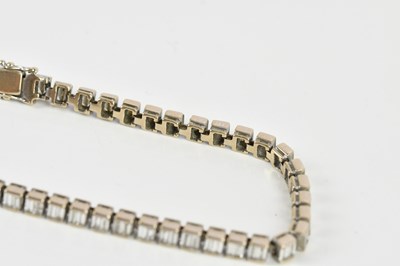 Lot 15 - A white metal diamond set tennis bracelet,...