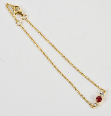 Lot 222 - An 18ct yellow gold diamond and ruby set...