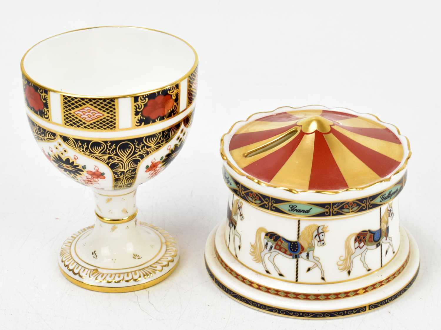 Lot 504 - ROYAL CROWN DERBY; a Treasures of Childhood carousel money box