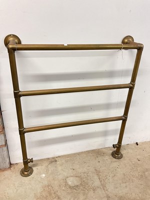 Lot 200 - A vintage brass heated towel rail, width 80cm.