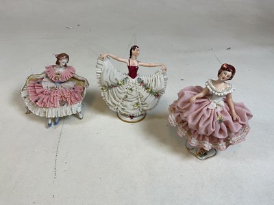 Lot 230 - Three Dresden porcelain figures with lace...