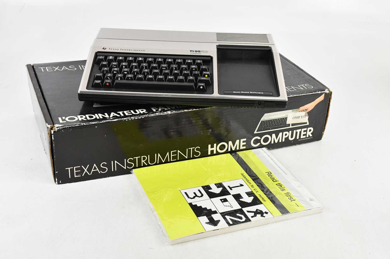 Lot 2450 - TEXAS INSTRUMENTS; a home computer, TI-99/4A,...
