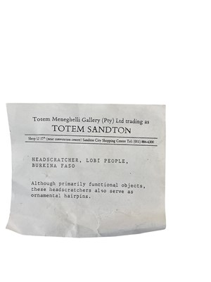 Lot 770 - Two Lobi people, Burkina Faso head scratchers...