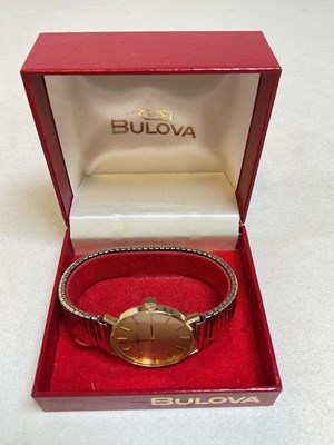 Lot 367 - BULOVA; a vintage 9ct yellow gold wristwatch...