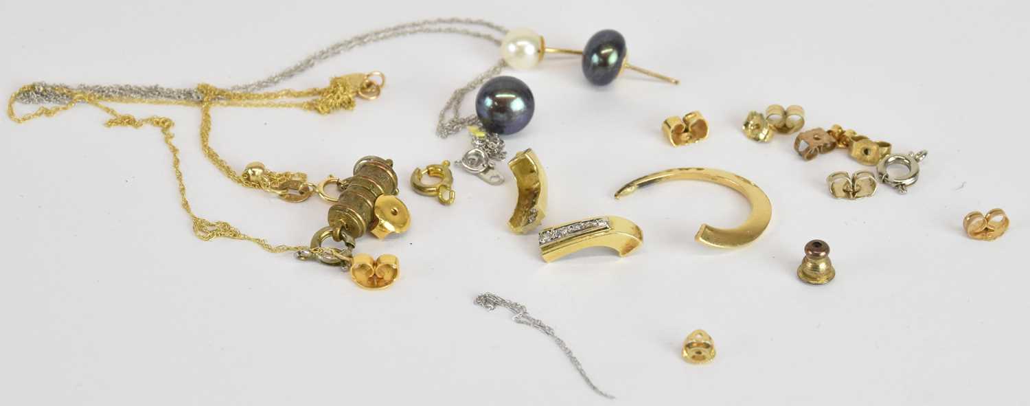 Lot 1202 - A quantity of scrap 9ct gold, yellow and white...