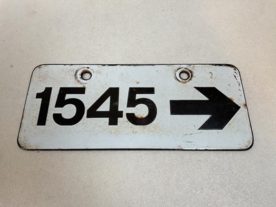 Lot 7 - A vintage railway enamel sign '1545' with an...