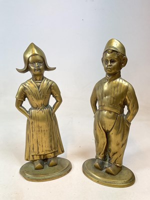 Lot 207 - A large pair of brass flat backed figures...