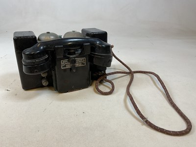 Lot 90 - A black military field telephone.