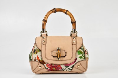 Lot 640 - GUCCI; a floral print canvas handbag with...