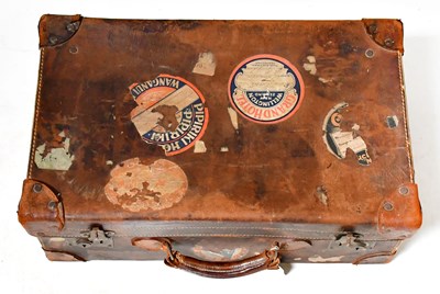 Lot 698 - A vintage suitcase with various partial paper...