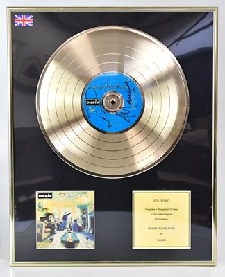 Lot 322 - OASIS; a gold disc, 'Definitely Maybe', signed...