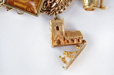 Lot 810 - A 9ct yellow gold curb link charm bracelet...