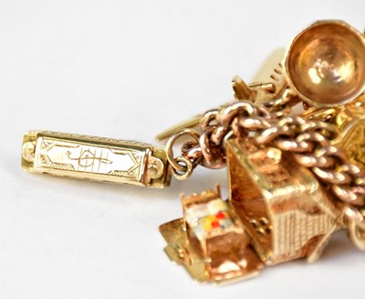 Lot 810 - A 9ct yellow gold curb link charm bracelet...