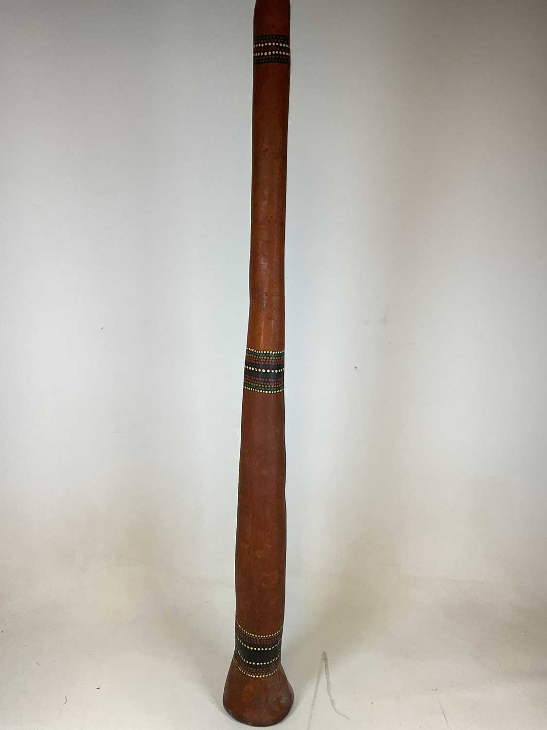 Lot 52 - An Aboriginal didgeridoo with three bands of...