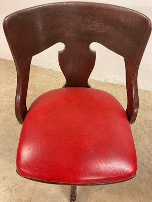 Lot 743 - An early 20th century revolving office chair...