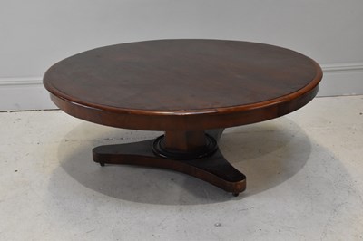 Lot 1180 - A large mahogany coffee table with circular...