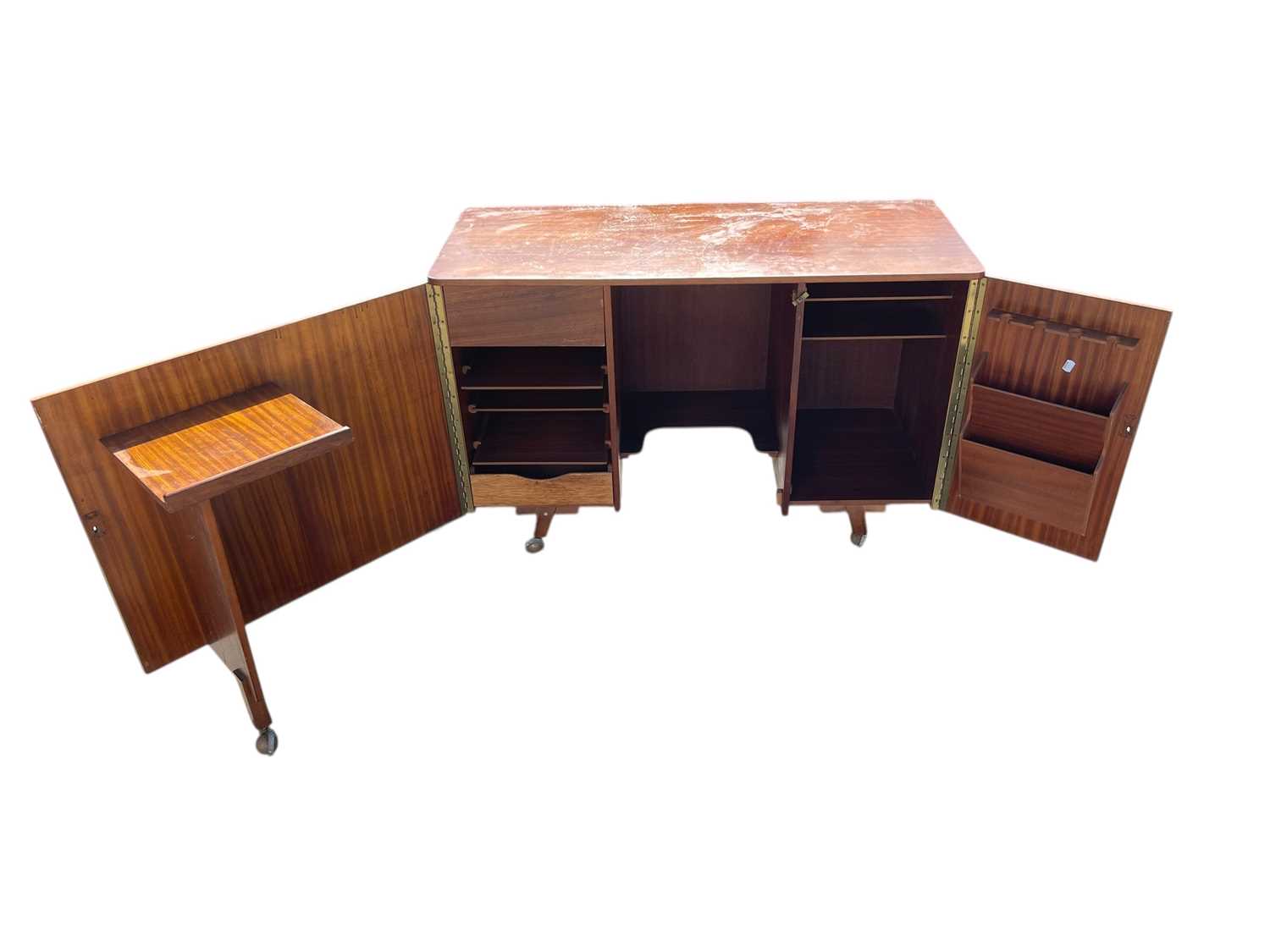 Lot 2311 - A mid century teak magic box type desk in the...