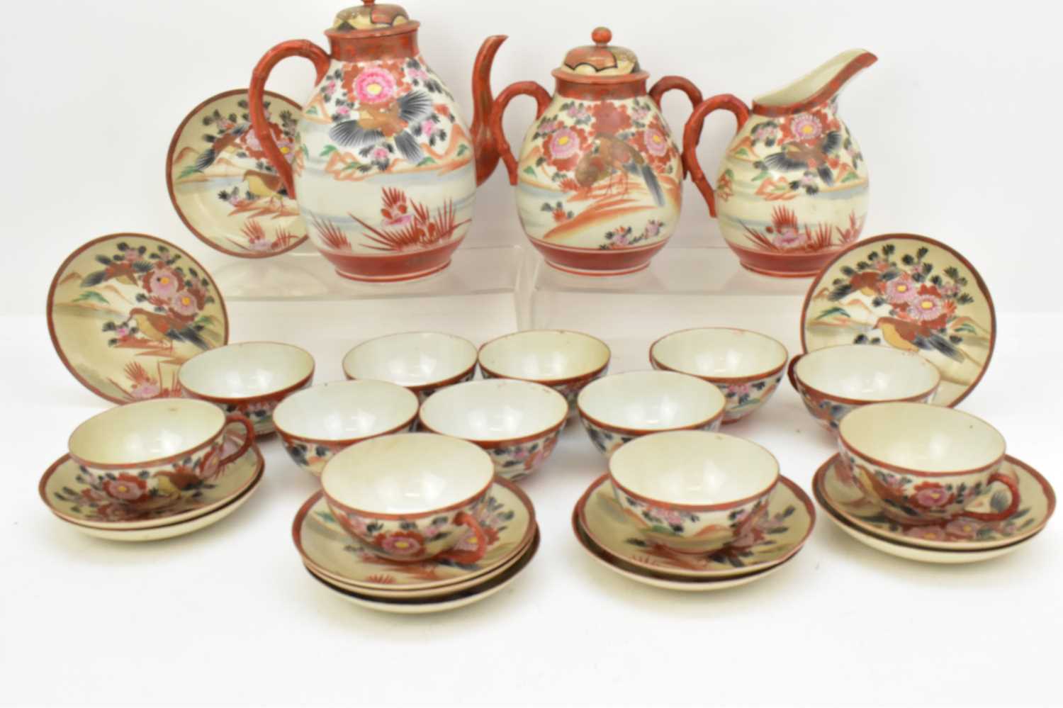 Lot 260 - A Japanese iron red tea set comprising