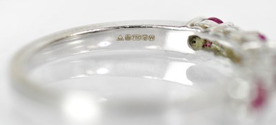 Lot 766 - An 18ct white gold ring set with four rubies...