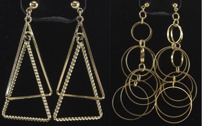 Lot 1315 - A pair of triangular yellow metal drop...