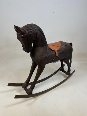 Lot 154 - A small Continental rustic rocking horse with...