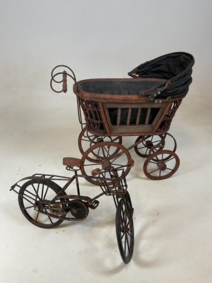 Lot 163 - A doll's pram and a rustic scratch built...