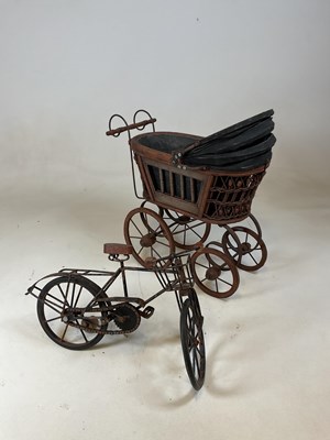 Lot 163 - A doll's pram and a rustic scratch built...