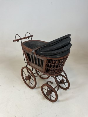 Lot 163 - A doll's pram and a rustic scratch built...